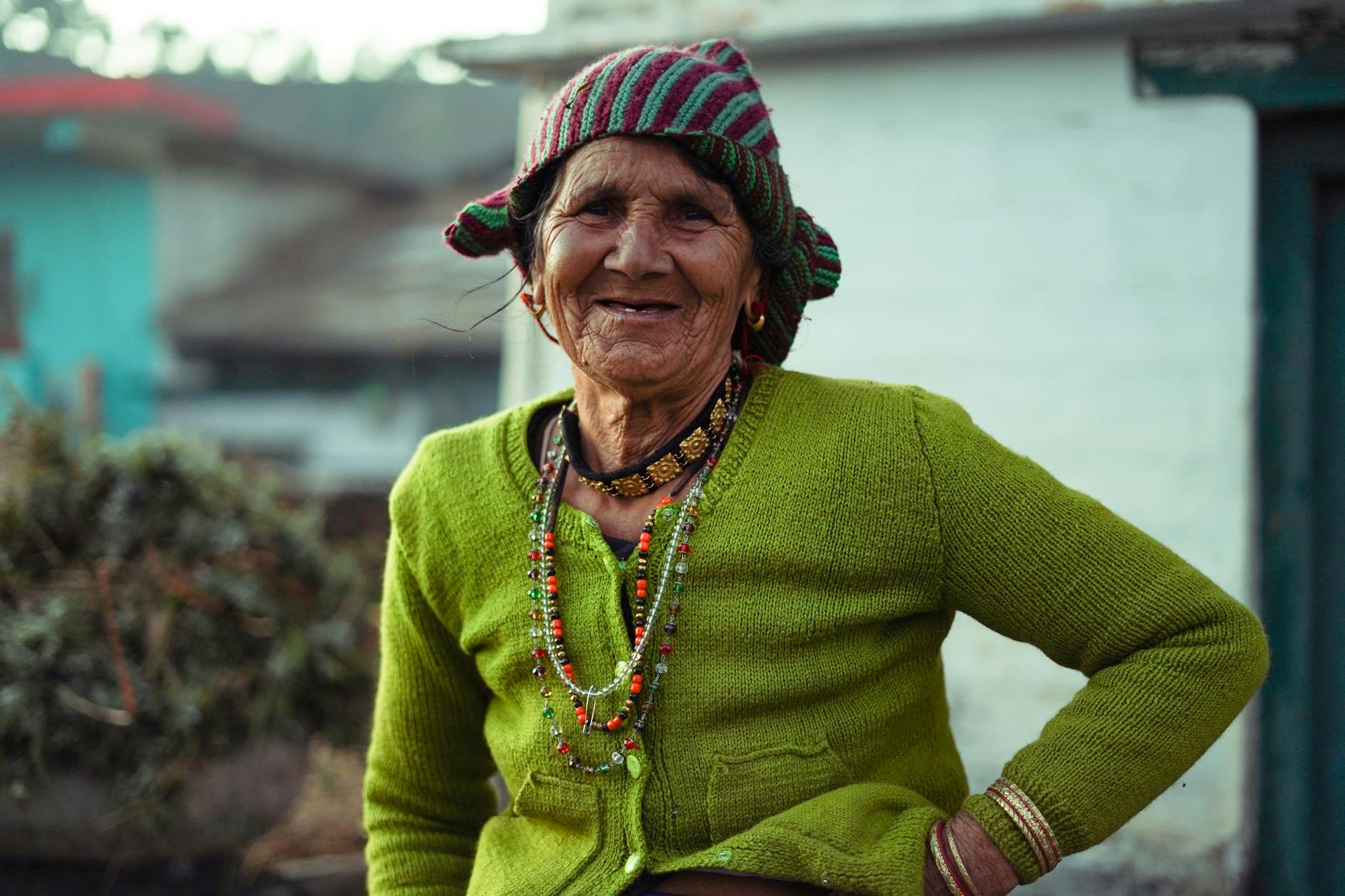 woman in green sweater smiling